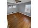 Spacious bedroom featuring hardwood floors and neutral walls at 2244 Alpha Dr, Decatur, GA 30032