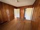 Bedroom with wood paneling and hardwood floors at 2244 Alpha Dr, Decatur, GA 30032