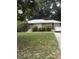 Brick ranch house with a spacious lawn and mature trees at 2244 Alpha Dr, Decatur, GA 30032