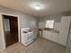 Kitchen with white cabinets, tile floors, and gas range at 2244 Alpha Dr, Decatur, GA 30032