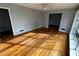 Bright living room with hardwood floors and large windows at 2244 Alpha Dr, Decatur, GA 30032