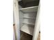 Small pantry with white shelves at 2244 Alpha Dr, Decatur, GA 30032