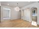 Breakfast room with hardwood floors, built-in bar, and light-filled alcove at 2515 Habersham Nw Rd, Atlanta, GA 30305