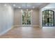 Formal dining room with hardwood floors, large window, and Venetian plaster walls at 2515 Habersham Nw Rd, Atlanta, GA 30305