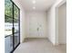 Light-filled entryway with tile floors and glass door at 2515 Habersham Nw Rd, Atlanta, GA 30305