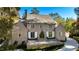 Brick home with a gabled roof, multiple windows, and a large front porch at 2515 Habersham Nw Rd, Atlanta, GA 30305