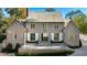 Brick home with a gabled roof, white shutters, and a large front porch at 2515 Habersham Nw Rd, Atlanta, GA 30305