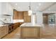 Bright kitchen with an island, marble countertops, and oak cabinets at 2515 Habersham Nw Rd, Atlanta, GA 30305