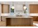 Large kitchen island with marble countertop and light oak cabinets at 2515 Habersham Nw Rd, Atlanta, GA 30305