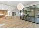 Open kitchen with island, hardwood floors, and glass wall to Gathering room at 2515 Habersham Nw Rd, Atlanta, GA 30305