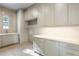 Bright laundry room with ample storage and counter space at 2515 Habersham Nw Rd, Atlanta, GA 30305