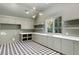 Bright laundry room with ample storage and stylish tile floor at 2515 Habersham Nw Rd, Atlanta, GA 30305