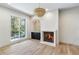 Bright living room with hardwood floors, fireplace, and built-in bar at 2515 Habersham Nw Rd, Atlanta, GA 30305