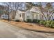 Townhouse with gray siding and stone accents, located on a quiet street at 4018 Bayside Cir, Atlanta, GA 30340