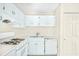 White kitchen features gas range and dishwasher at 4018 Bayside Cir, Atlanta, GA 30340