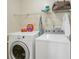 Laundry room with washer, dryer, and shelving at 4018 Bayside Cir, Atlanta, GA 30340