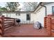 Wooden deck with seating area, grill, and backyard access at 1486 Akridge Nw St, Atlanta, GA 30314