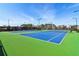 A vibrant tennis court and green perimeter at 2865 Ferncliff St, Cumming, GA 30028