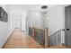Second floor hallway with hardwood floors and a modern light fixture at 3378 Bachelor St, Atlanta, GA 30344