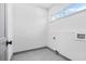 Laundry room with gray flooring and built-in shelving at 3378 Bachelor St, Atlanta, GA 30344