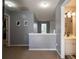 Upstairs hallway with neutral walls and carpet, connecting bedrooms and bathroom at 3408 Sandlake Dr, Marietta, GA 30008