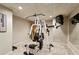 Basement gym with weight machine and mirror at 5534 Asheforde Way, Marietta, GA 30068