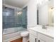 Updated bathroom with a walk-in shower, soaking tub, and modern vanity at 887 Commonwealth Se Ave, Atlanta, GA 30312