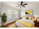 Bright bedroom featuring hardwood floors and a large window at 887 Commonwealth Se Ave, Atlanta, GA 30312