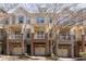 Brick townhouses with attached garages and balconies at 887 Commonwealth Se Ave, Atlanta, GA 30312