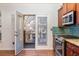Kitchen with door leading to private balcony at 887 Commonwealth Se Ave, Atlanta, GA 30312