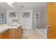 Bathroom featuring dual sinks, a soaking tub, and a separate glass-enclosed shower offers spa-like experience at 3235 Roswell Ne Rd # 615, Atlanta, GA 30305