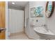 Bathroom featuring a corner sink and shower/tub combination with a curtain at 3235 Roswell Ne Rd # 615, Atlanta, GA 30305