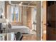 Bedroom boasts exposed brick, large windows with lots of natural light, and a view of the city at 3235 Roswell Ne Rd # 615, Atlanta, GA 30305