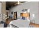 Spacious bedroom with exposed brick wall, modern decor, and hardwood floors at 3235 Roswell Ne Rd # 615, Atlanta, GA 30305