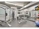 Well-equipped gym featuring weight machines, free weights, mirror wall, and TV screen at 3235 Roswell Ne Rd # 615, Atlanta, GA 30305