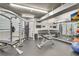 On-site gym features weight training equipment, mirrored walls, and television at 3235 Roswell Ne Rd # 615, Atlanta, GA 30305