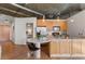 View of kitchen and living area, featuring bar seating and hardwood flooring at 3235 Roswell Ne Rd # 615, Atlanta, GA 30305