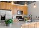 Well-lit kitchen features wood cabinets, stainless steel appliances, and a breakfast bar at 3235 Roswell Ne Rd # 615, Atlanta, GA 30305
