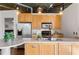 Modern kitchen features wood cabinets, stainless steel appliances, and an open design at 3235 Roswell Ne Rd # 615, Atlanta, GA 30305