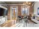 Inviting living space boasts exposed brick, large windows, and contemporary furnishings for a cozy atmosphere at 3235 Roswell Ne Rd # 615, Atlanta, GA 30305