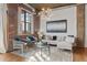 Bright living room featuring stylish decor, exposed brick, and an open layout for modern living at 3235 Roswell Ne Rd # 615, Atlanta, GA 30305