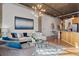 Inviting living room featuring a modern lighting fixture, hardwood floors, and sleek decor at 3235 Roswell Ne Rd # 615, Atlanta, GA 30305