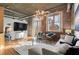Inviting living space boasts exposed brick, large windows, and contemporary furnishings for a cozy atmosphere at 3235 Roswell Ne Rd # 615, Atlanta, GA 30305