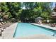 Community pool with plenty of lounge chairs and trees at 3235 Roswell Ne Rd # 615, Atlanta, GA 30305