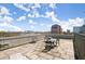Spacious rooftop terrace with wrought iron furniture, overlooking cityscape at 3235 Roswell Ne Rd # 615, Atlanta, GA 30305