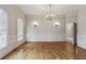 Formal dining room with hardwood floors and chandelier at 505 Semira Sw St, Atlanta, GA 30331