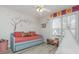 Cozy bedroom with a daybed, window seat, and fun decor at 85 Bartlett Way, Dallas, GA 30157