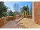Spacious deck with wooden railings, overlooking a wooded area at 1078 Meadow Brook Dr, Woodstock, GA 30188