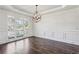 Formal dining room with hardwood floors and wainscoting at 1078 Meadow Brook Dr, Woodstock, GA 30188