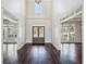 Bright entryway with hardwood floors and views to other rooms at 1078 Meadow Brook Dr, Woodstock, GA 30188